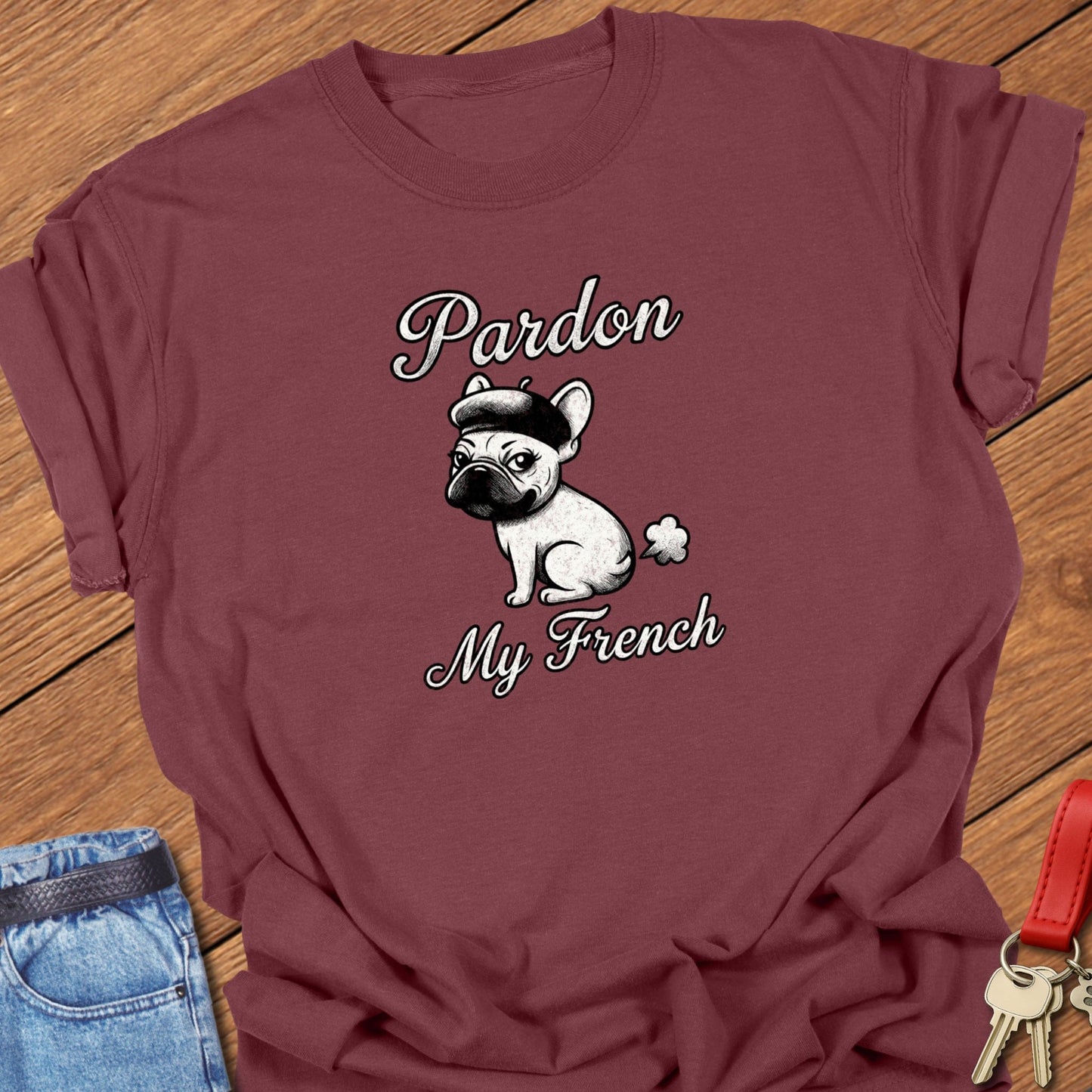 French bulldog illustrated wearing a beret with “Pardon My French” typography printed on brick Comfort Colors t shirt