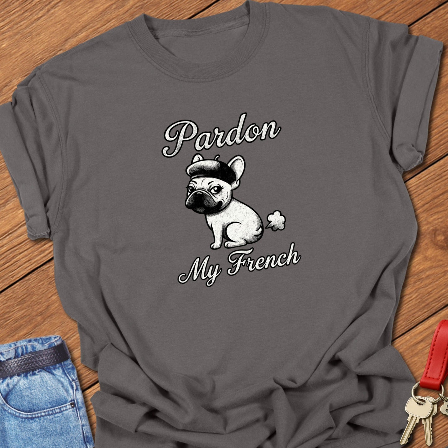 French bulldog illustrated wearing a beret with “Pardon My French” typography printed on pepper Comfort Colors t shirt